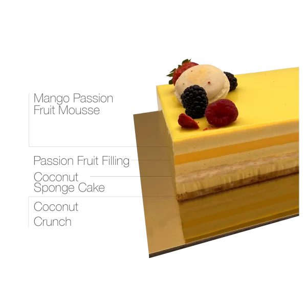 A tantalizing Passion Mango Mousse Cake adorned with macarons and tropical fruits.