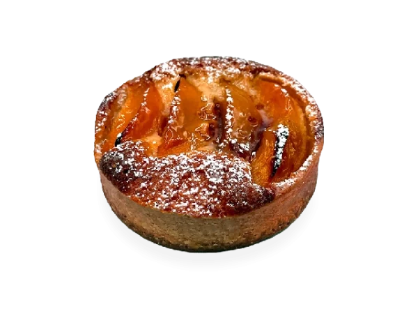 Scrumptious French tart with a buttery crust, filled with juicy peach slices, and garnished with a sprinkle of powdered sugar. Pierre and Michel your authentic French bakery