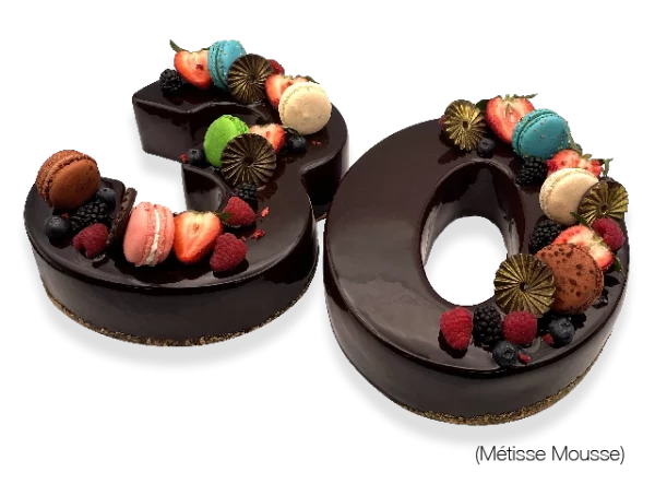 A visually stunning French Number Métisse Mousse Cake handcrafted by Pierre and Michel Authentic French Bakery in New Jersey.