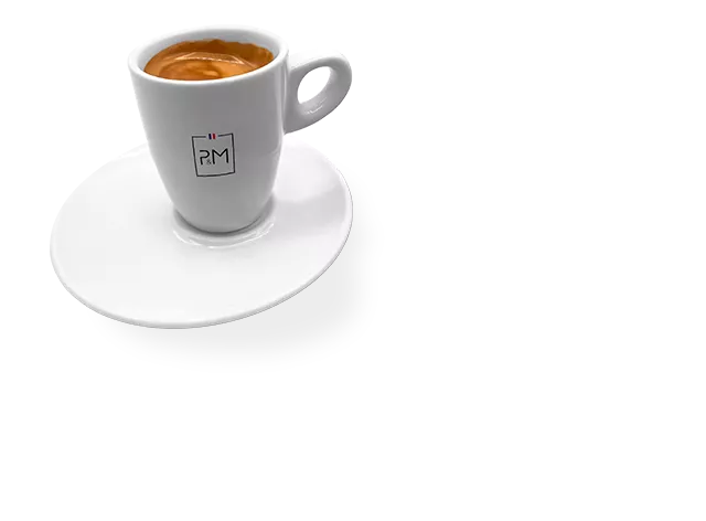 A shot of freshly brewed espresso in a small cup.