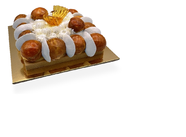 A stunning French Saint Honoré cake with layers of puff pastry, cream puffs, caramelized sugar, and a decadent whipped cream topping.