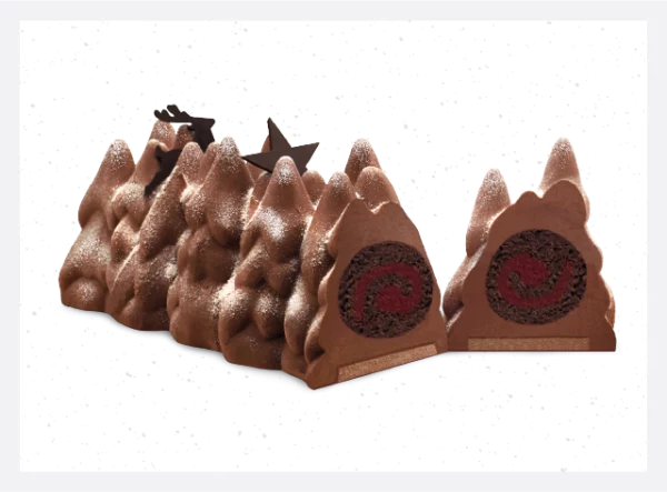 A delectable Buche De Noel Yule Log by PIERRE AND MICHEL, featuring a winter forest-inspired design with layers of dark chocolate mousse, raspberry filling, and chocolate hazelnut crunch. A festive treat for the holidays!