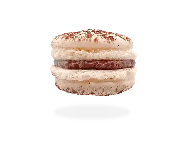 French Bailey's Irish cream macaron with a velvety filling and a dusting of cocoa powder by Pierre and Michel your authentic French bakery.