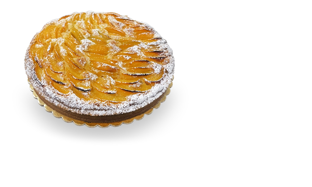Scrumptious French tart with a buttery crust, filled with juicy peach slices, and garnished with a sprinkle of powdered sugar. Authentic French cakes by Pierre and Michel in New Jersey