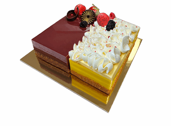 A delectable Duo Cake featuring two layers with different flavors, beautifully decorated with swirls of frosting and fresh fruit toppings.