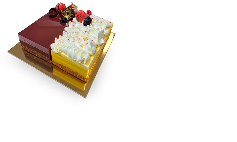 A delectable Duo Cake featuring two layers with different flavors, beautifully decorated with swirls of frosting and fresh fruit toppings.