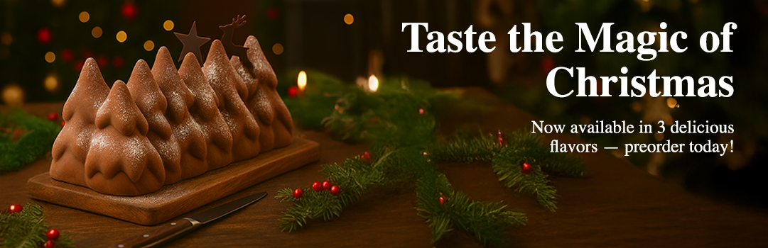 Handcrafted Christmas Cake (Bûche de Noël) made with premium ingredients, topped with festive decorations, freshly prepared in New Jersey French bakery.